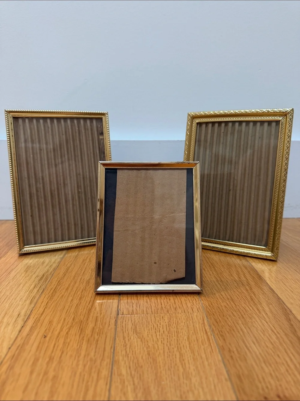Set of three vintage gold table picture frames. 2x 5x7, 1x 4x6